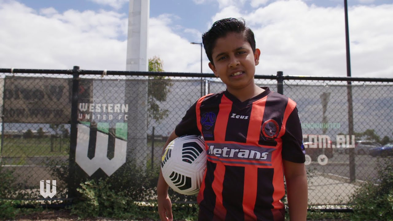 Young footballers Ronaq and Nihal visit Mark Rudan during Members Week