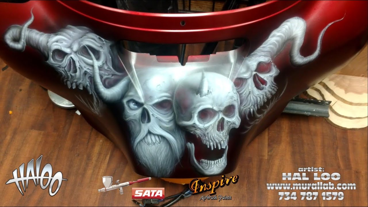 Freehand skulls on a Harley fairing