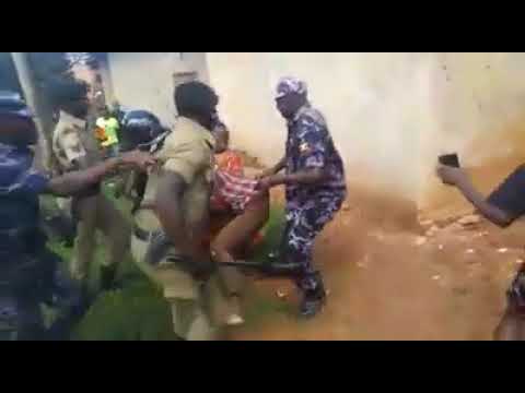 Ugandan police officers brutally arrest a young man & his mother