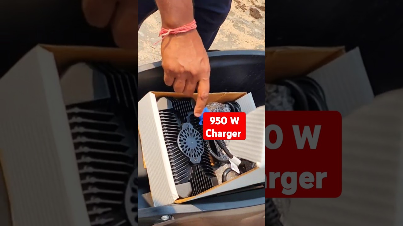 TVS iqube boot space and charger of board charger 950 watt charger IP rating 