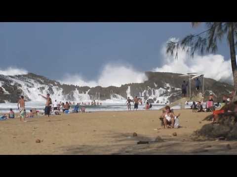 Rocks breaking waves on enclosed beach in Puerto Rico