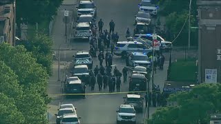Chicago police continue search for suspects in officer shooting