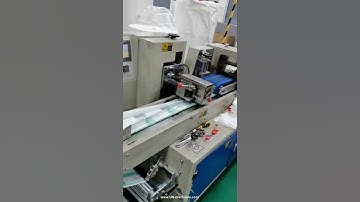 Automatic diposal napkin cutting feeding flow type bag packing machine
