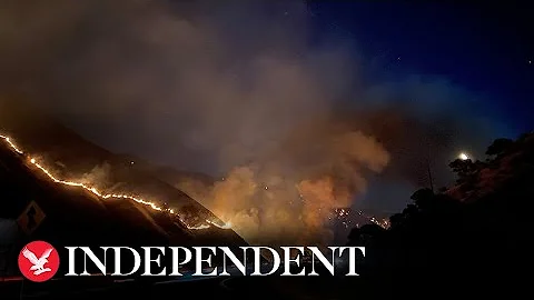 Fire crews fight huge blaze in Southern California national forest