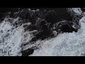 Blue green ocean waves on Black Rocks - Free Stock Footage