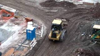 CAT 963C track loader working in a foundation