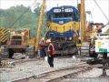 Derailed locomotive gets lifted onto the rails