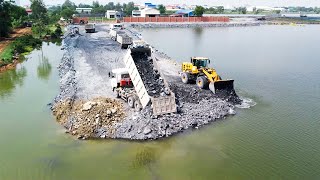 Lot Of Dump Truck Dumping Stone Wheel Loader Moving Stone To Deep Water For Build New Road!