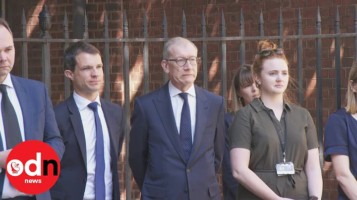 Philip May winces as he watches PM in tears