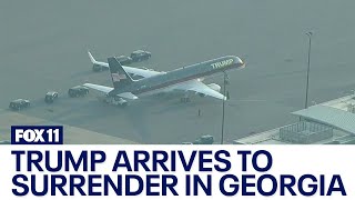 Trump arrives in Georgia to surrender