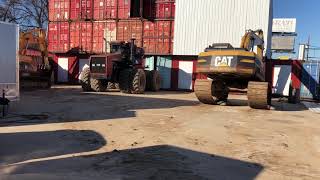 Moving 250,000 lbs of Connexes Metal Buildings Trackhoe Excavator 8wd Tractor