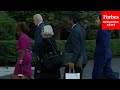 Watch biden again flanked by aides upon return to white house