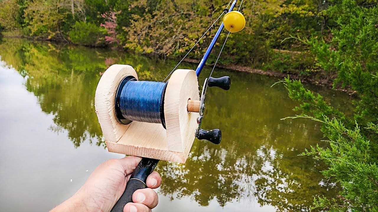 A modern spinning reel with a fishing line and a homemade spoon with a cord  tied to it, wound on a wooden reel. Stock Photo by ©Ostariyanov 235807722