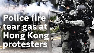Hong Kong protests: police fire tear gas to disperse crowds