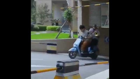 Man Playing Trombone on Motorbike
