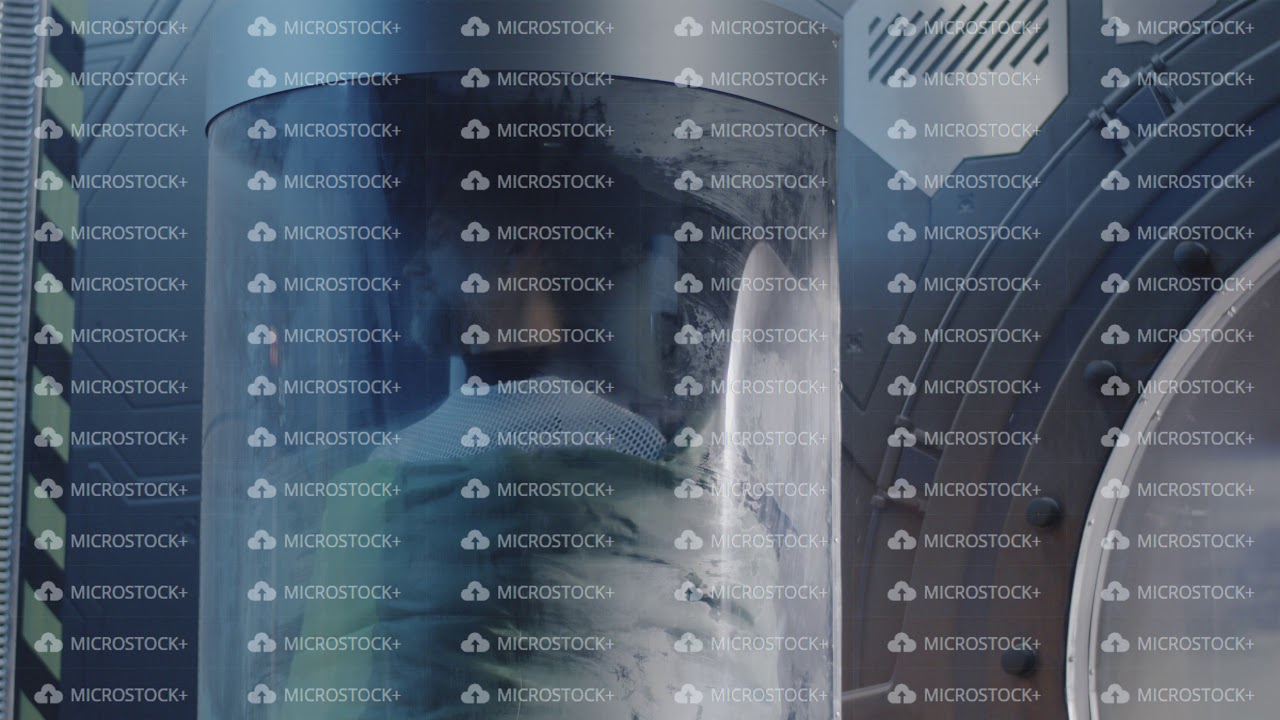 Male astronaut sleeping in a glass pod