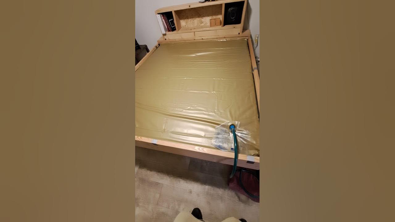 Drain my waterbed with a pump with a garden hose to the tub in the