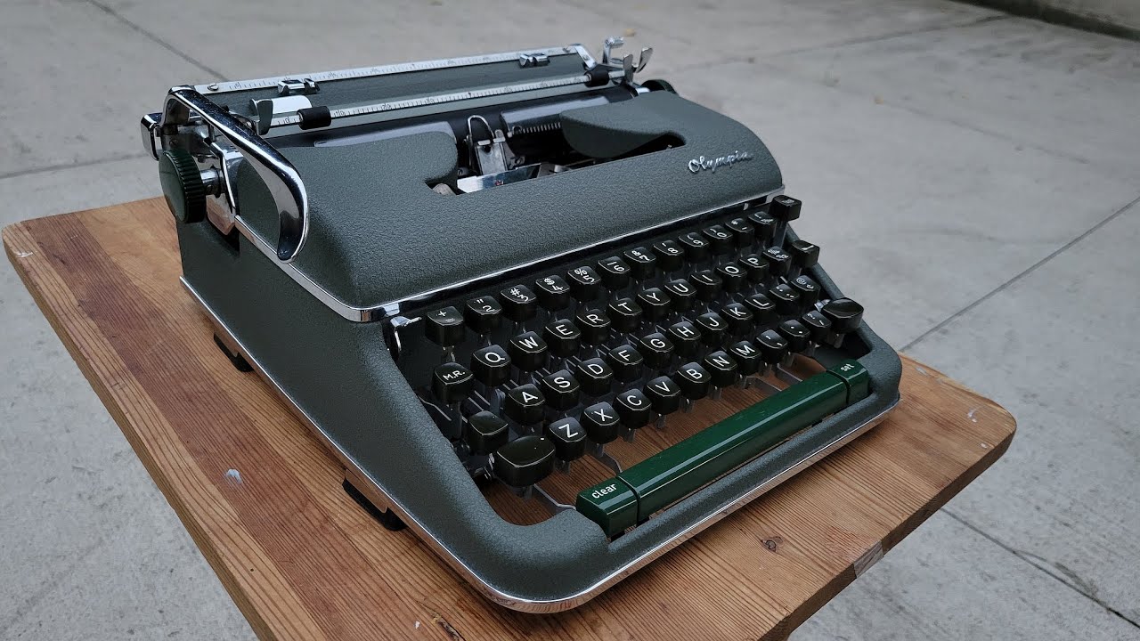 Typing outside on a 1960 Olympia SM-4 typewriter - YouTube