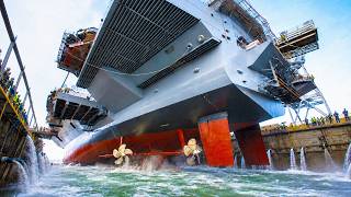 US Navy Rolls Out a Massive Aircraft Carrier From Dry Dock