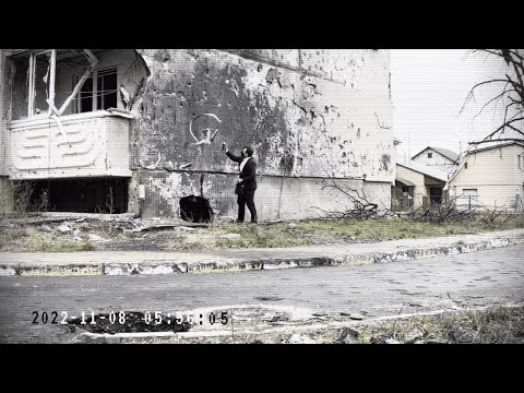 Was Banksy Caught on Camera in Irpin? New artwork on damaged building in Ukraine.