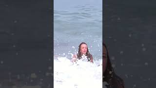 Woman Taken out by Wave During Photoshoot