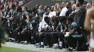 NFL players protest during the US national anthem at Wembley