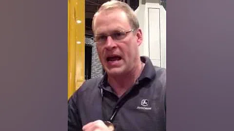 John Chesterman of John Deere talks with Tina Grad...