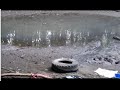 Pulling a tire out of the shoreline at Roxboro Island PART 1