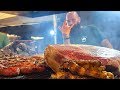 Irish Street Food. Roasting Blocks of Angus Meat on Huge Grills