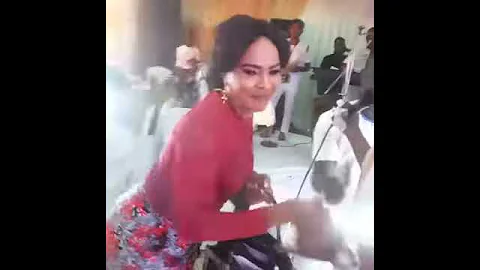 Saidi Balogun sprays his ex-wife, actress Fathia, at Mercy Aigbe's birthday party.