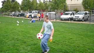 Nicholas Alexander "dribbling" soccer ball