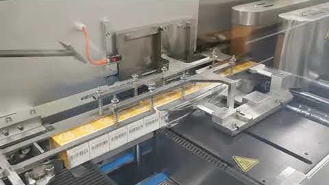 High Speed Over Wrapping Machine connecting to high-speed cartoning machine