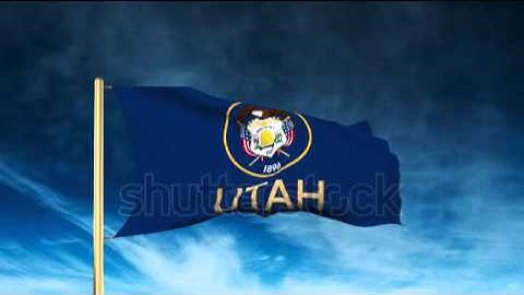 utah flag slider style with title. Waving in the wind with cloud background animation Stock video