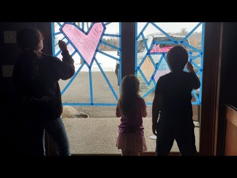 Daycare Children Paint Windows At Staples-Motley Elementary School