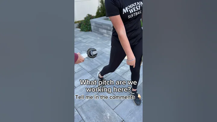 Learning her first movement pitch with the spin stick! #softball #softballpitching #shorts
