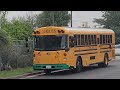 Two 2020 blue bird rear motor electric school buses on a field trip empty bus ride to the school