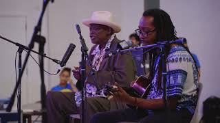 Phil Wiggins & Hubby Jenkins – “Stop and Listen” (2023 Smithsonian Folklife Festival)
In July 2023, the revered blues harmonica player Phil Wiggins, accompanied by guitarist Hubby Jenkins, performed in the final concert of the Smithsonian Folklife Festival. In the Smithsonians Arts and Industries Building, the performers paid tribute to 75 years of Folkways Records.
Now we pay tribute to Wiggins, who passed away on May 7, 2024. He had been a nearly lifelong supporter and participant at the Folklife Festival, going back to his teen years in the 1970s. He performed in the early years with singer and guitarist Flora Molton and numerous times with his longtime musical partner, the Piedmont blues guitarist John Cephas. In his last Festival appearance, he reveled in playing for a hometown crowd.
Cameras: Rameshwar Bhatt, Nadya Ellerhorst, Eve Moore, Elliot Senatov
Editor: Charlie Weber
Catalog No. CFV11723; © Smithsonian Institution, 2024 Phil Wiggins & Hubby Jenkins – “Stop and Listen” (2023 Smithsonian Folklife Festival)
