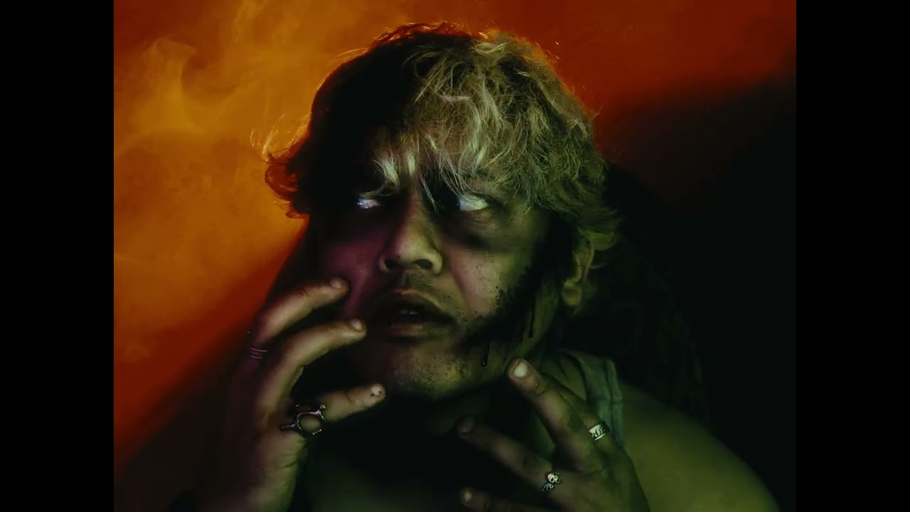 Don Miralles in a dramatic amber-lit scene from Paranoid