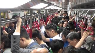 A lot of people in the subway or metro hong kong. absolute main
activity is staring at their phone's screens. good choice if i may say
so myself. subs...