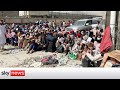 Desperation, as thousands queue next to Kabul airport