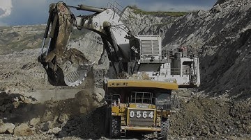 Big Digger Liebherr R 9350 Loading Overburden into Komatsu HD785 & Caterpillar 777