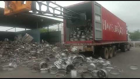 JCB 530-110 Telehandler - Metal Scrap (Wheel Rims) Unloading from Close Body Truck