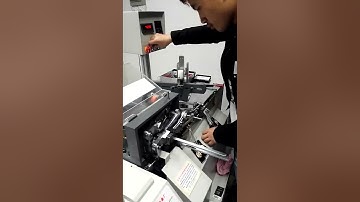 Fully automatic rope threading machine  #machine #garment #factory #packaging #rope #threading #tag