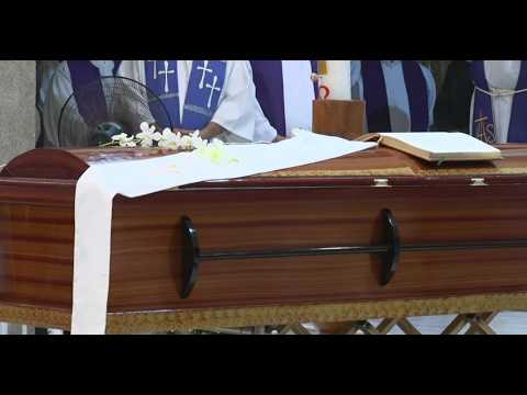 Parishioners bid farewell to Father Patricio Sánchez at a crowded wake