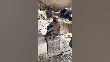 Shaping stone block using hammer and chisel