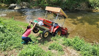 Super highland female driver drives a tractor to pull corn beds.@QuangMinhToan