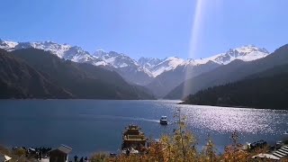 Tianchi, Xinjiang where you can experience four seasons scenery in one time