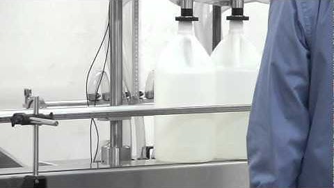 Semiautomatic Pressure overflow liquid filler, manufactured by Acasi Machinery