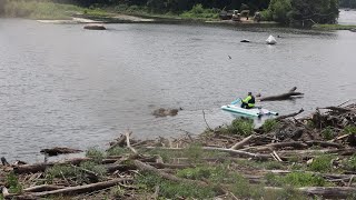 Debris and logs are removed from around the T. Potterfield Bridge