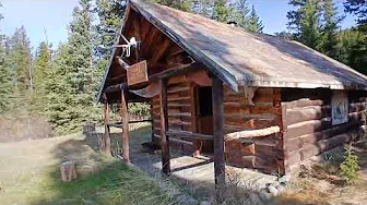 Nordegg in the Mountains and nice views by a creek a cabin and wood  shed  Alberta